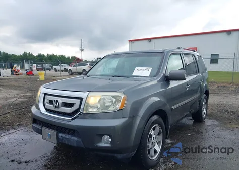 2010 Honda Pilot Touring z USA, uszkodzony, nr VIN 5FNYF3H9XAB007496